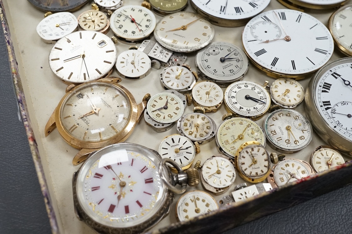 A quantity of assorted wrist and pocket watch movements, including Omega and Omega automatic, together with a pocket watch and a 935 white metal fob watch.